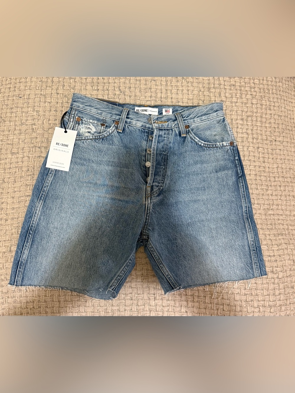 Re/Done faded blue high-rise button-fly denim shorts